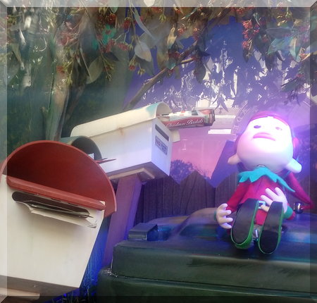 Myer elf beside some letter boxes
