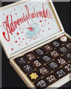 wooden box with numbered chocolates