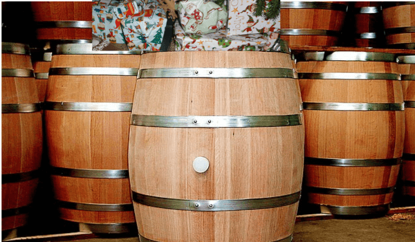 Presents on wooden barrels 600x350 1 | love santa A ile of presents sitting on top of a large timber barrel ahead of Christmas