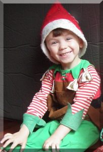 Boy in Christmas elf costume