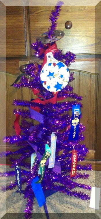 Christmas tree covered in sports ribbons