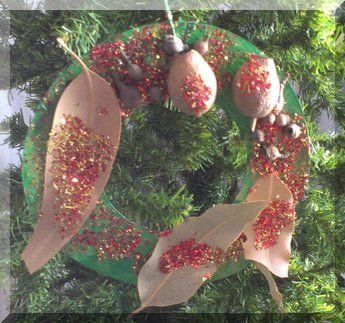 Red and gold glitter on gumnuts and gum leave wreath