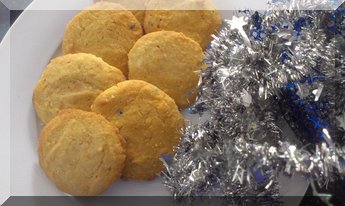 Passionfruit Christmas biscuits on a white plate for serving