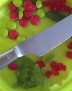 | love santa red and green smarties and jelly babies on a plate