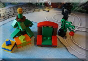 Lego presents udner a Christmas tree beside Santa's chair