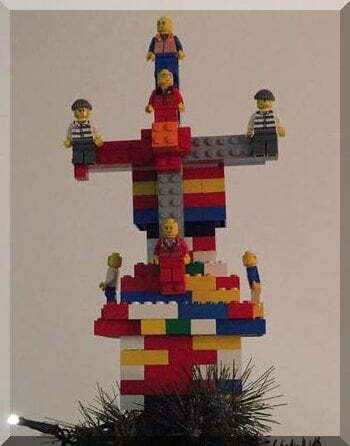 A Lego Christmas star on top of a Christmas tree