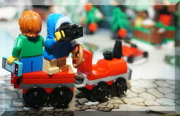 Lego people standing on a train carriage from the advent calendar