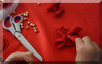 | love santa Little hands gluing petals onto a felt circle