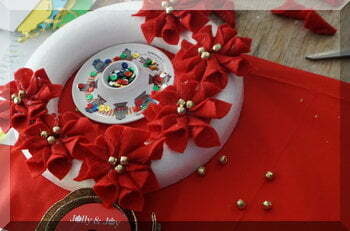 | love santa Foam wreath partially covered by red felt flowers