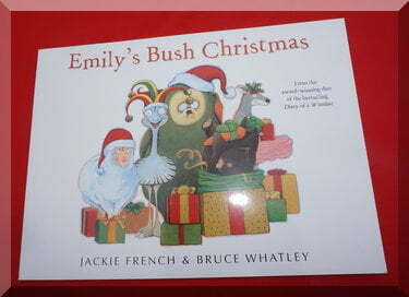 Front cover of "Emily's Bush Christmas" showing Australian animals with presents, Santa hats and smiles