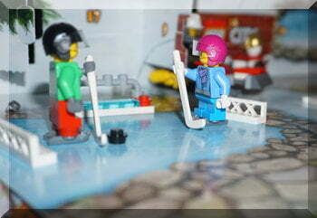 Two Lego characters ready for ice-hocket