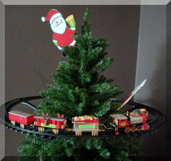 | love santa A Christmas train running around the top of a Christmas tree