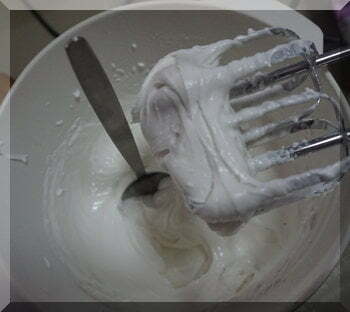 | love santa Spoon standing in icing to show how stiff the mixture is