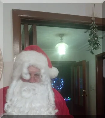 | love santa Santa standing under some mistletoe