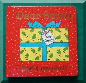 Front cover of book Dear Santa - shows a yellow gift tied with a blue ribbon