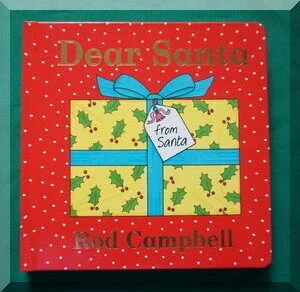 Front cover of book Dear Santa - shows a yellow gift tied with a blue ribbon