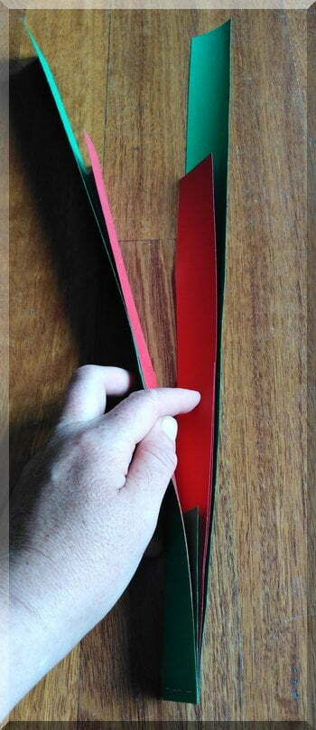 | love santa stapled strips of reed and green cardboard