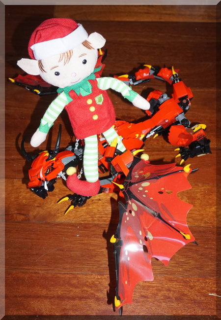 Elf sitting on a red Lego Ninjago dragon
