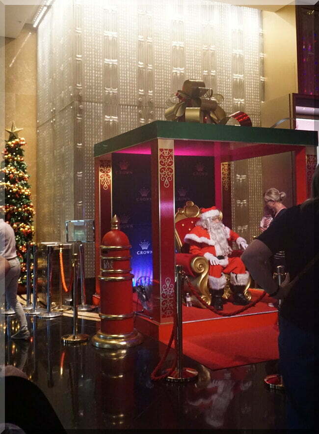 Santa sitting on a throne in Crown Melbourne