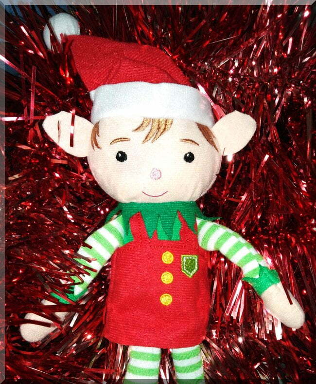 Tinkles_in_tinsel_portrait | love santa Tinkles the Christmas elf sitting amongst red tinsel