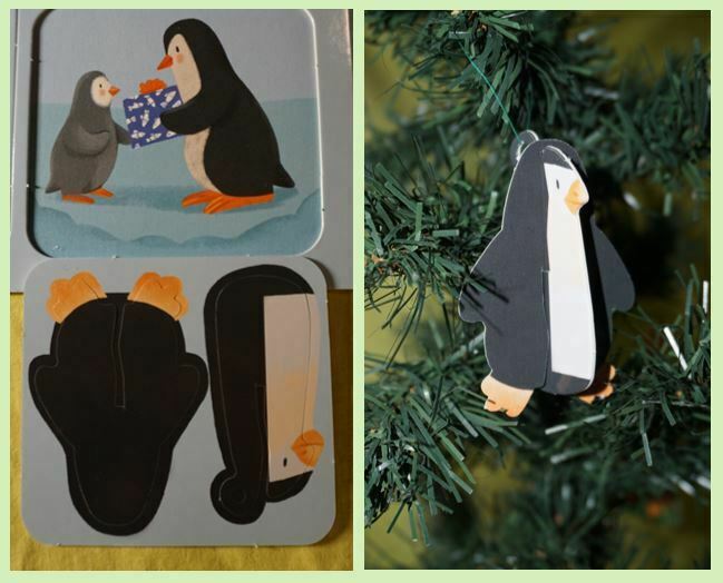 Cardboard penguin hanging on a Christmas tree