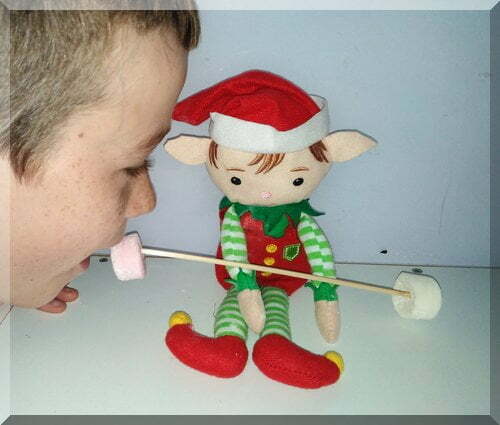 Boy trying ot eat elf's marshmallow weights