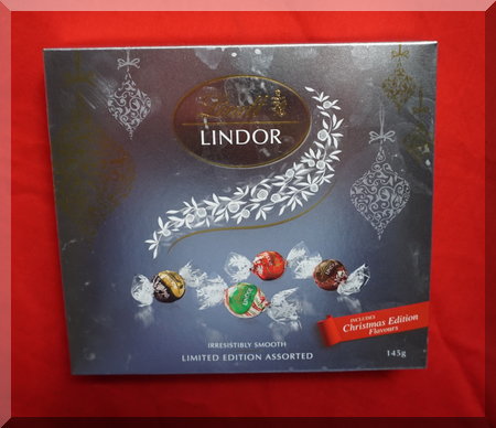 silver box containing Lindt chocolate balls