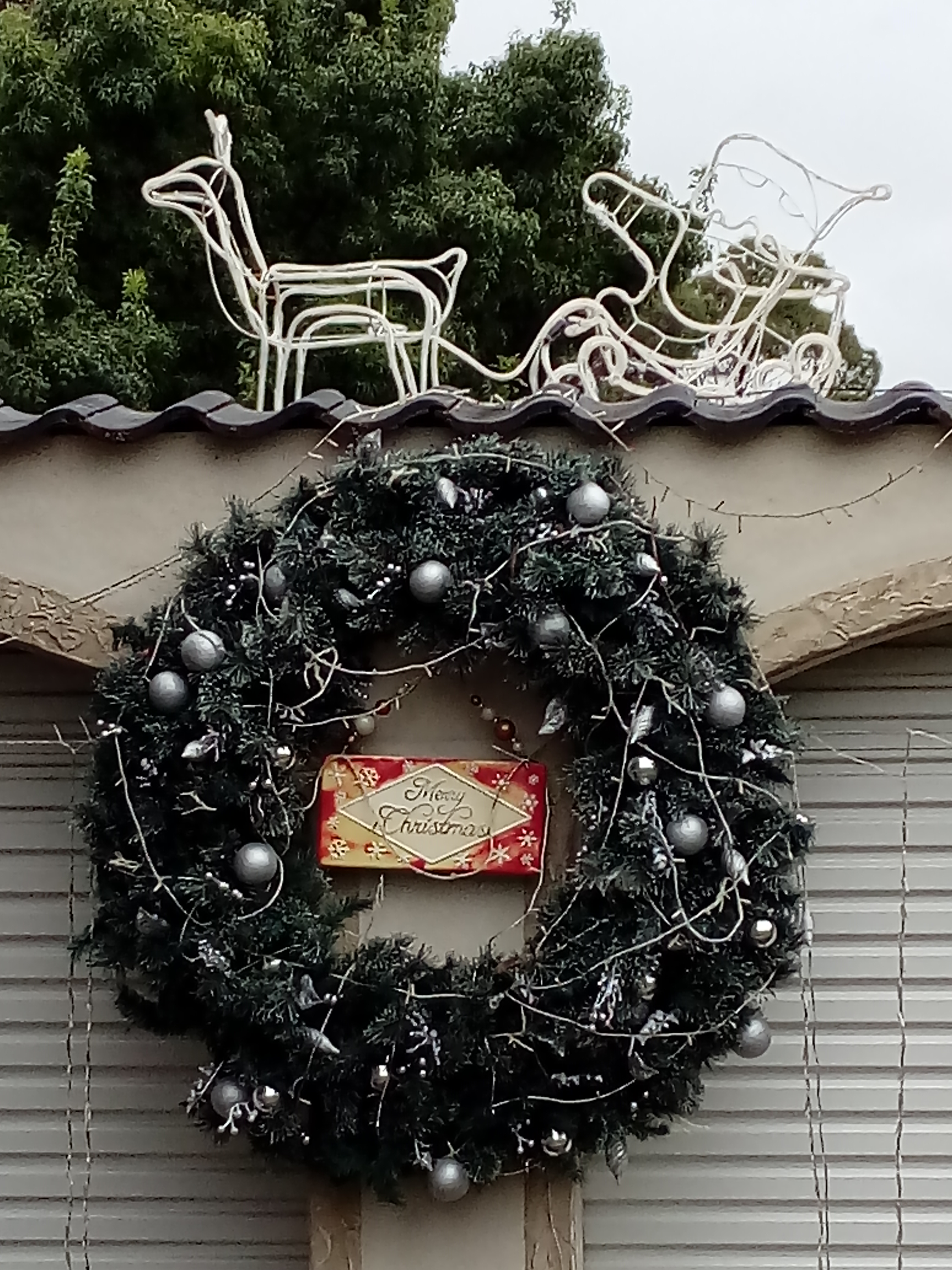 green Christmas wreath with fairy lights