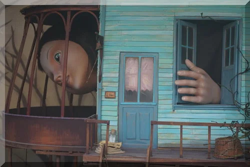 | love santa Alice poking her head out of a too small house