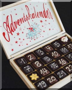 wooden box with numbered chocolates