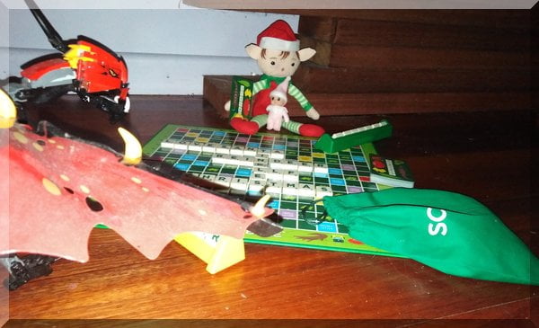 Christmas elf and Lego dragon playing Aussie Scrabble