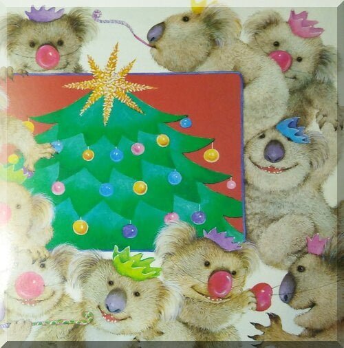 Laughing koalas around a Christmas tree