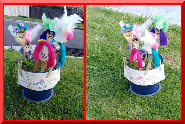 | love santa Spoons decorated as people standing in a bucket on the nature strip