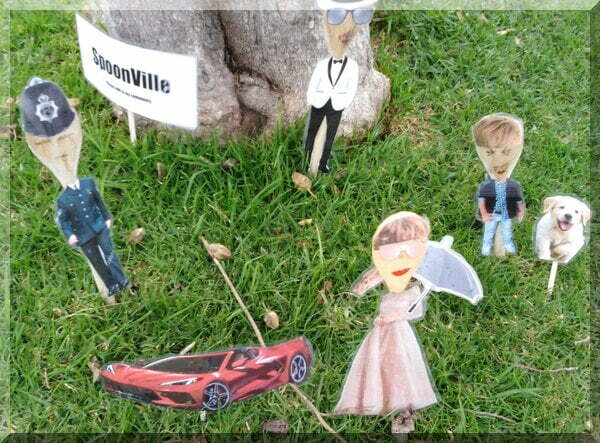 Laminated images standing under a tree as an alternative Spoonville.