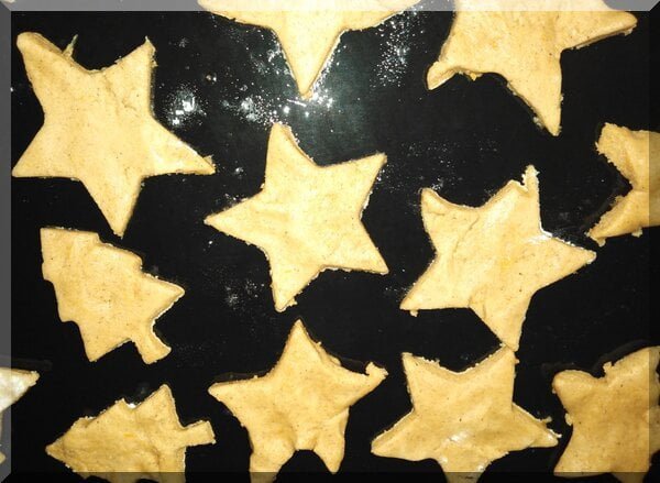 | love santa Pepparkakor biscuits (star and Christmas tree shapes) on a baking tray