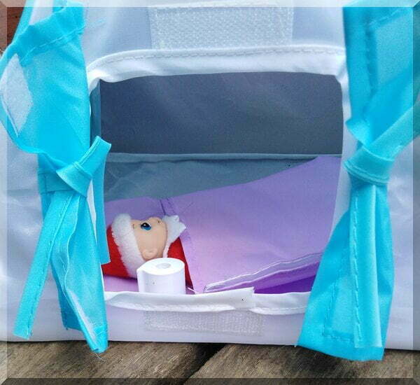 Ginger_nap_tent | love santa Baby Christmas elf lying in a purple sleeping bag inside a tent