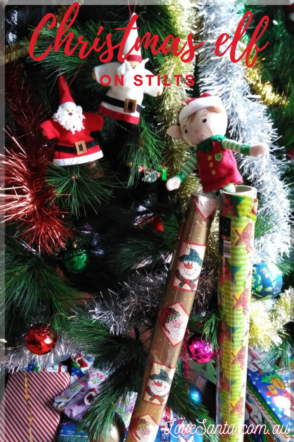 Christmas elves at the Christmas tree, being cheeky
