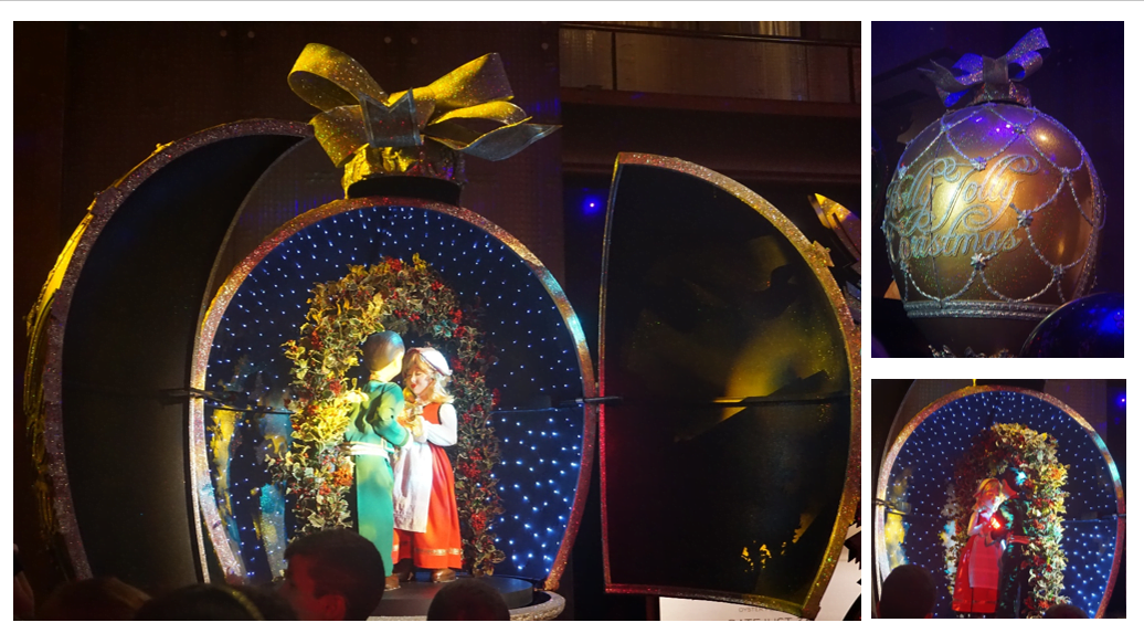 Golden egg with a dancing couple inside for a holly jolly Christmas