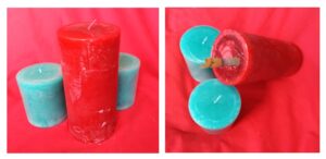 Gifting money via green and red candles - the red candle has a  notes in a hole at the bottom