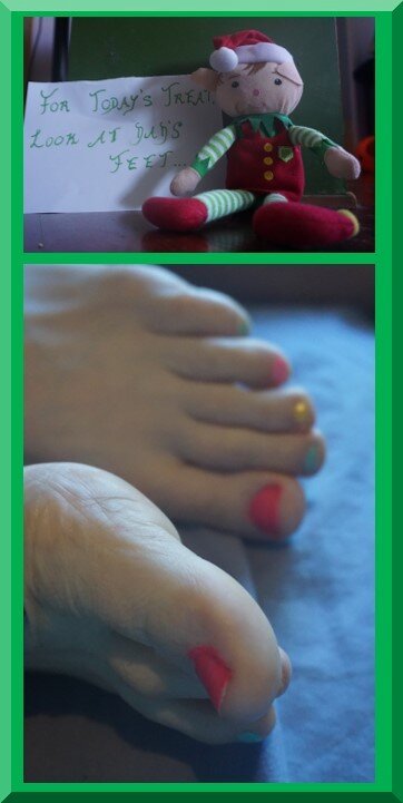 A Christmas elf with a note and a man's feet with multi-coloured nailpolish