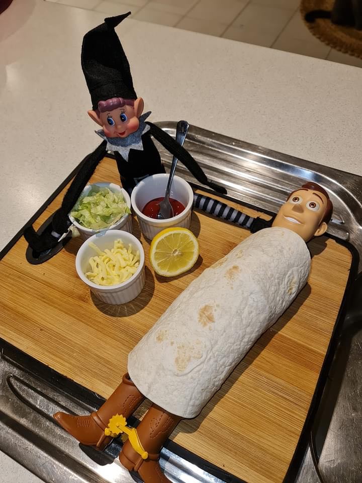 Christmas elf making a Woody burrito!