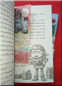 Money_in_book_600 | love santa Australian  note in the pages of a book with an elf picture