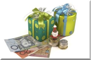 Image of some presents sitting on some Australian dollars with a toy Santa