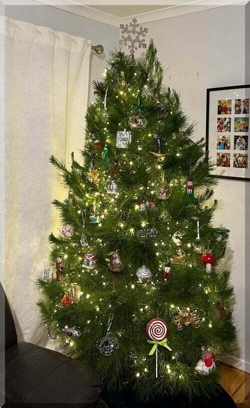 A real Christmas tree decorated tastefully with Disney elements