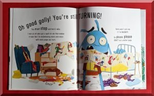 Inside pages of the book "Yule NOT open this book" showing a blue creature in a very messy room